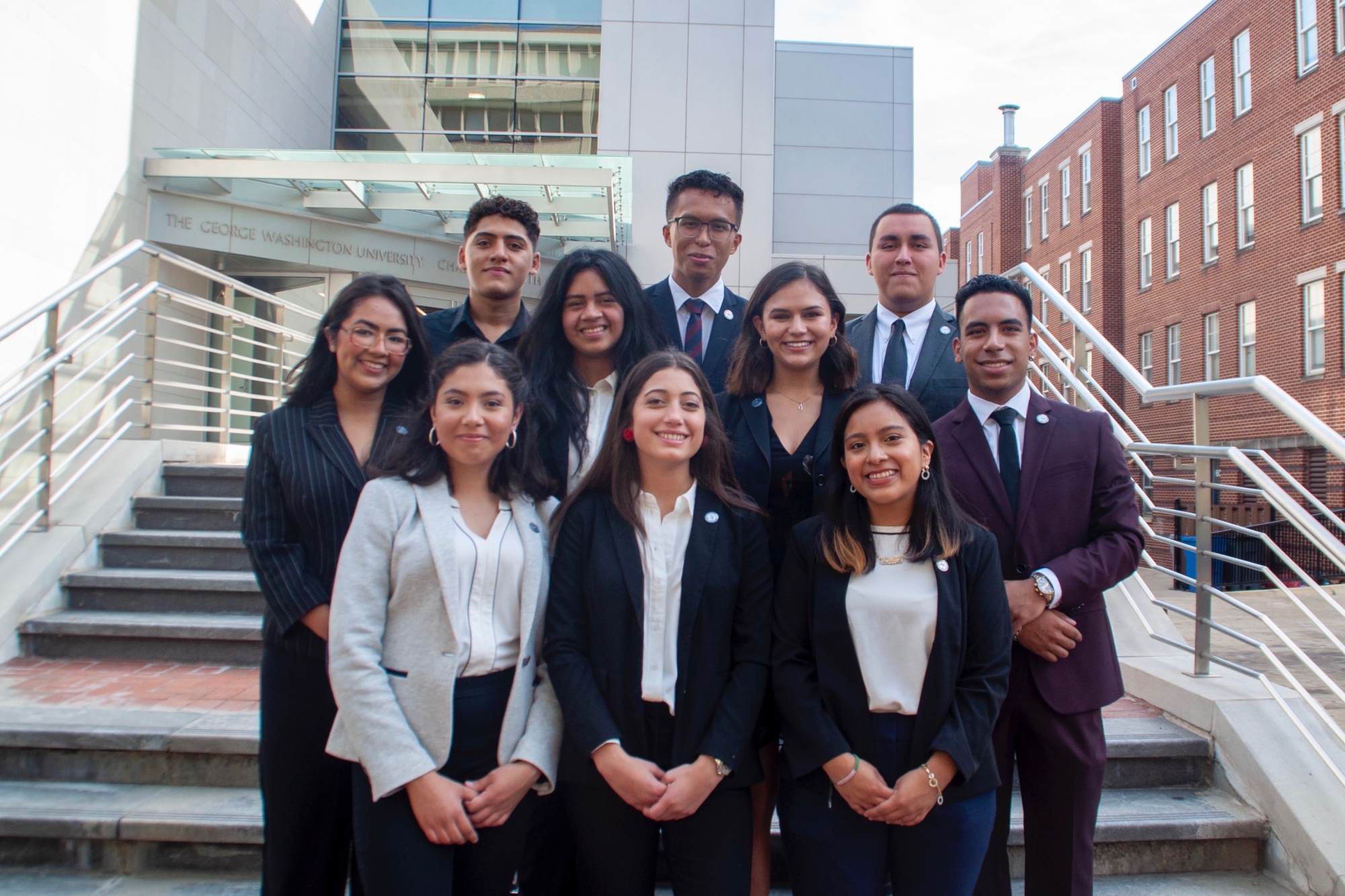 The Cisneros Scholars Class of 2023 stand together outside of the Smith Center