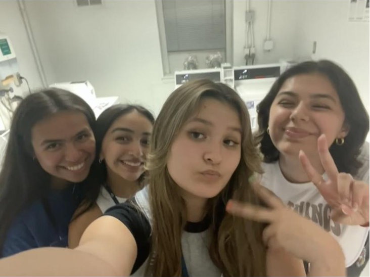 Four people taking selfie