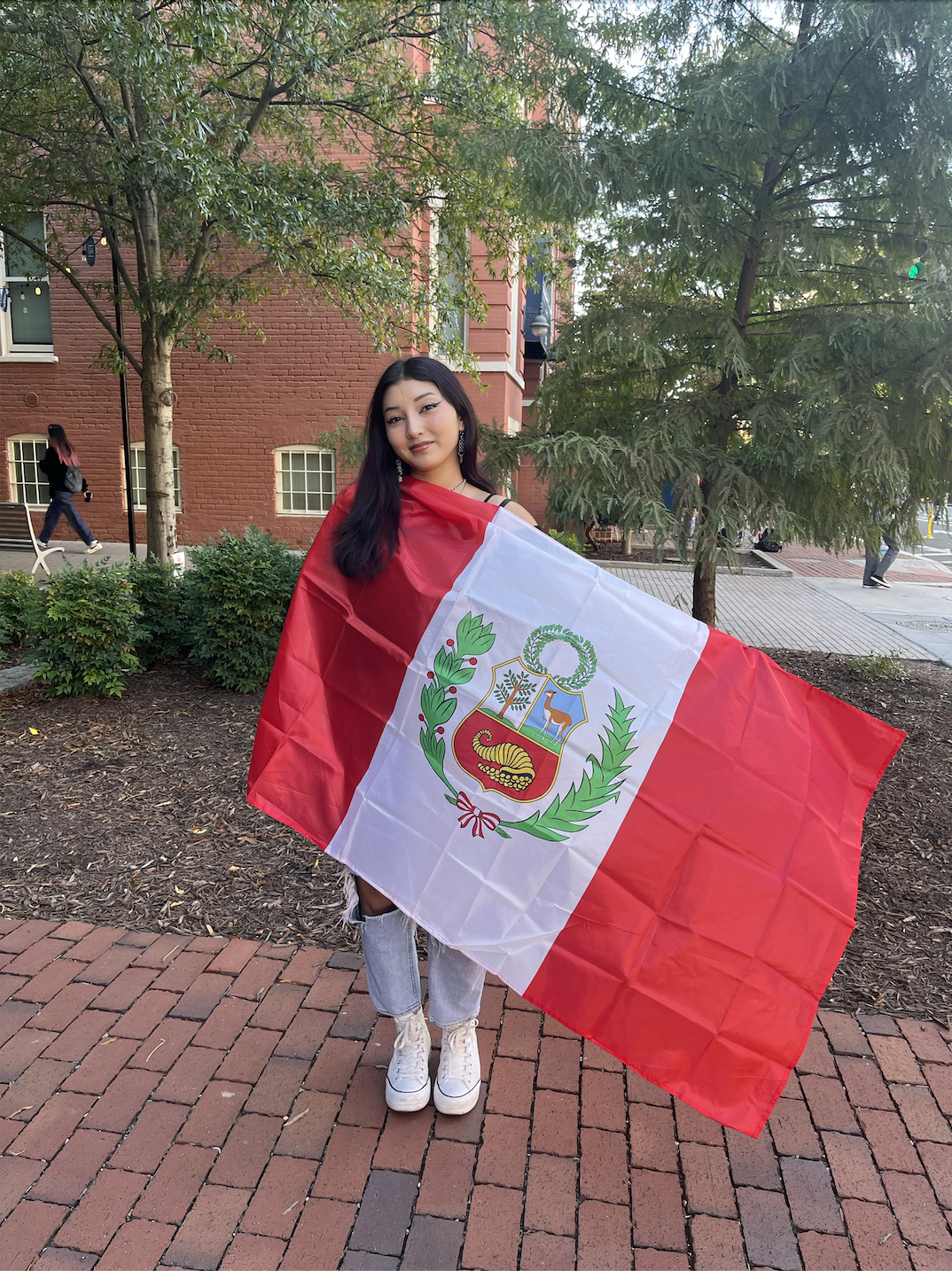 Nicole holding the Peruvian flag
