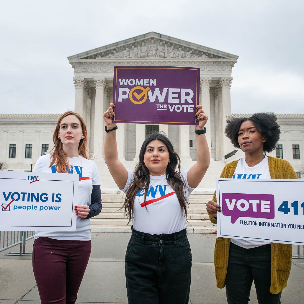people holding signs