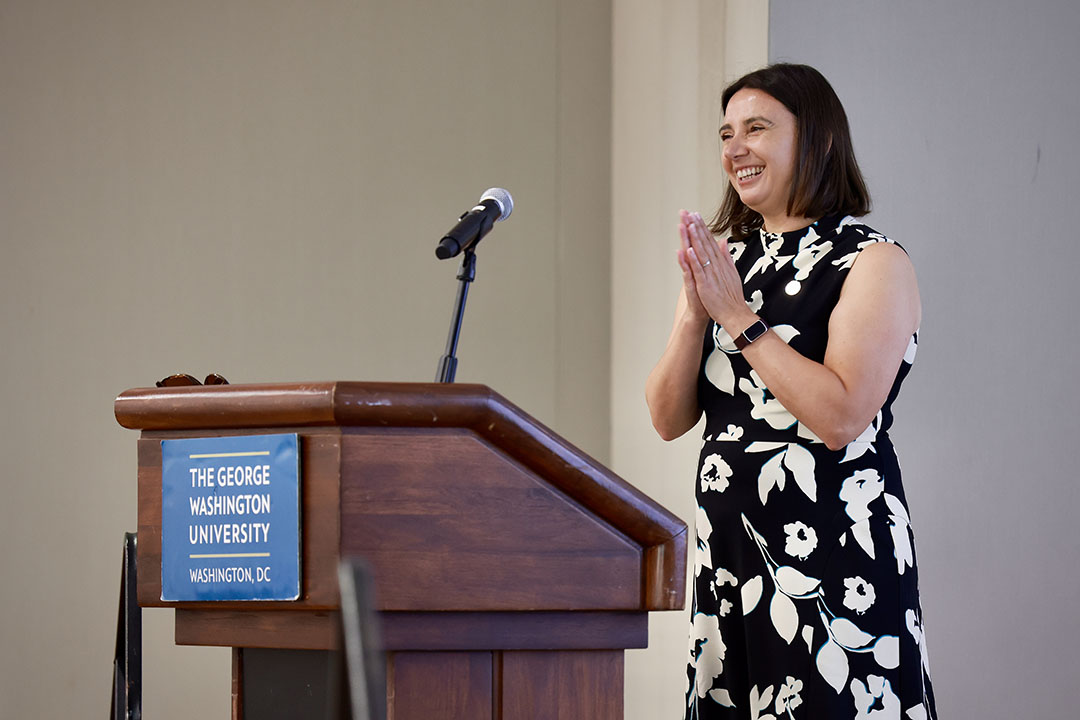 Individual speaking at the podium
