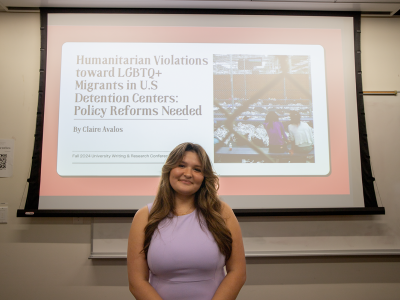 Student in front of a PowerPoint presentation