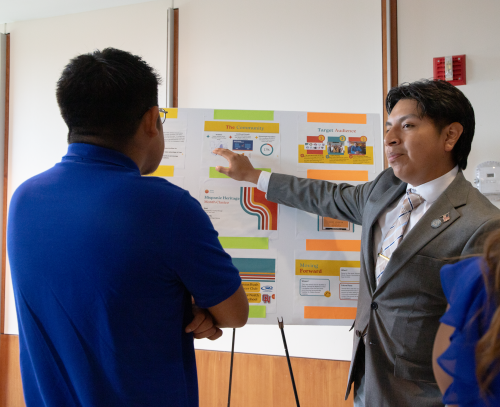 student presenting poster