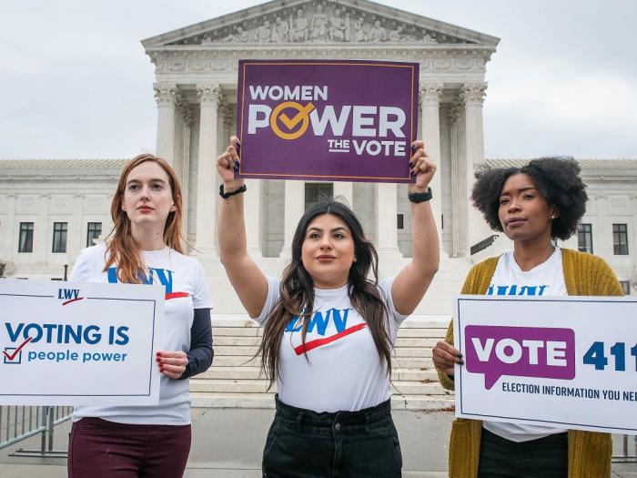 people holding signs