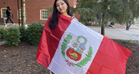 Nicole holding the Peruvian flag
