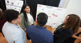 Student presenting posters
