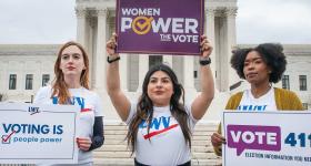 people holding signs